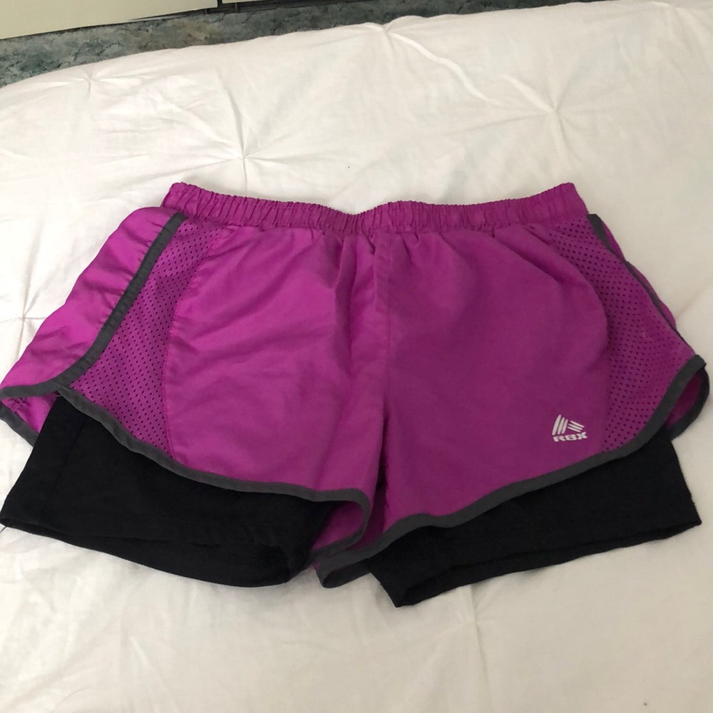 purple athletic shorts with spandex underneath.
